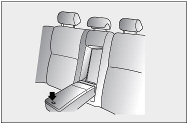 This armrest is located in the center of the rear seatback. Pull the armrest