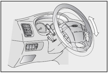 To change the steering wheel angle, pull up on the lock release (located beneath