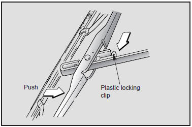 1. Raise the wiper arm and turn the wiper blade assembly to expose the plastic